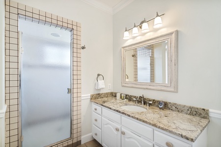 Elegant ensuite bathroom in the primary suite with modern finishes.