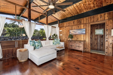 Relax in your tropical haven with soaring wood ceilings, white linens, and garden views through flowing curtains.