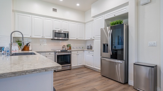 The kitchen is equipped with stainless steel appliances for your culinary adventures.