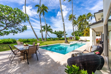 Enjoy meals and lounging just steps from the heated pool—where the ocean view stretches endlessly across the horizon.