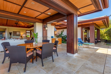 Dine alfresco in the covered outdoor dining area beside the cabana.