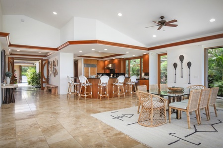 View toward the interior dining area and kitchen with wraparound bar seating beyond.