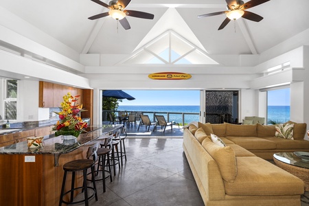 Open-concept design with high ceilings and island accents blends comfort with elegance.