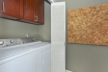 The laundry area with a washer and dryer.