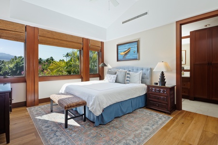 Wake up to tropical paradise through your bedroom windows, with lush palm trees creating your private island sanctuary.