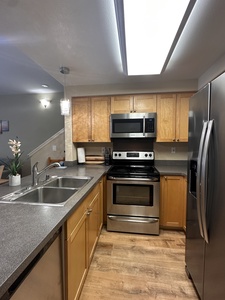 Primary suite with king bed, ensuite bathroom, garden views, and central AC for restful nights.