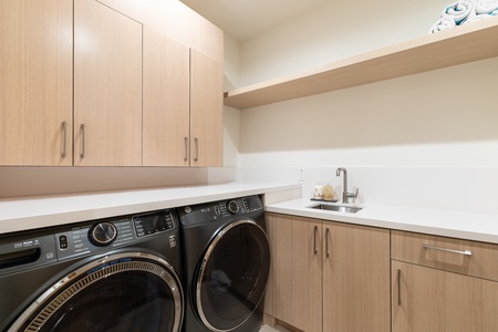 Your modern laundry room features sleek appliances and ample storage, making washing effortless during your stay.