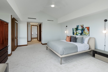 Minimalist-modern design creates a serene and bright atmosphere in this inviting guest suite.