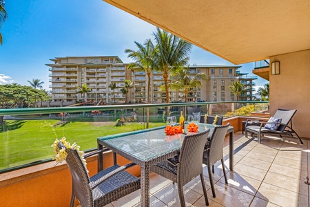Honua Kai Konea 206’s lanai has a dining table and scenic views, perfect for any meal.