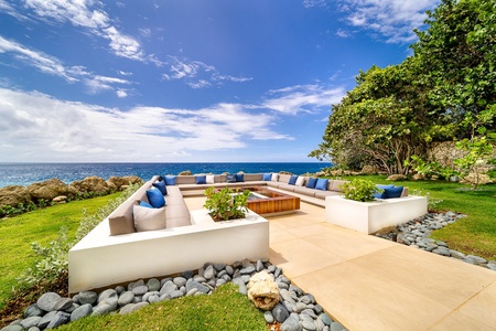 Elegant fire pit in the oceanfront lounge area with panoramic views.