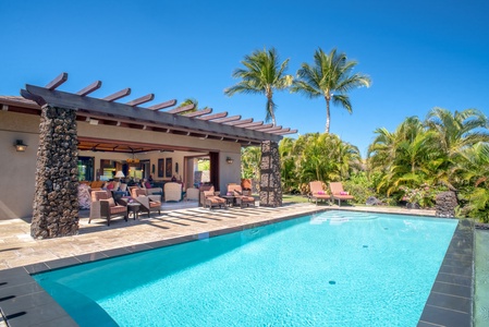 Your home away from home offers an infinity pool with exterior built lava rock wall.