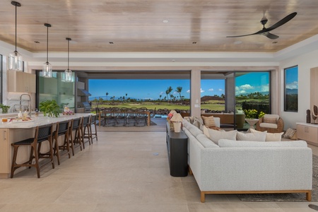 Seamlessly blending indoor comfort with stunning outdoor view of the lanai, this space is perfect for both relaxation and entertaining guests.