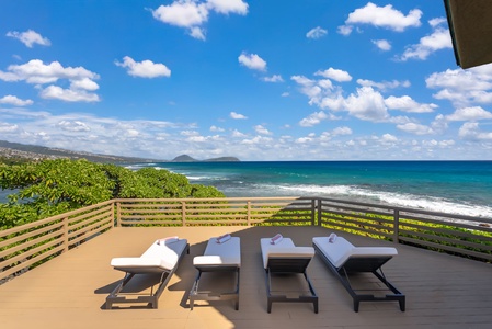 Gather around this elegant dining table where stunning ocean views frame every meal you'll share together.