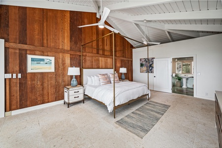 Primary bedroom has king bed, ensuite, ceiling fans, and ocean views