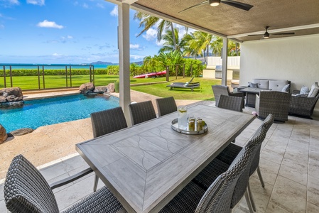 Enjoy al fresco dining by the pool with stunning ocean views.