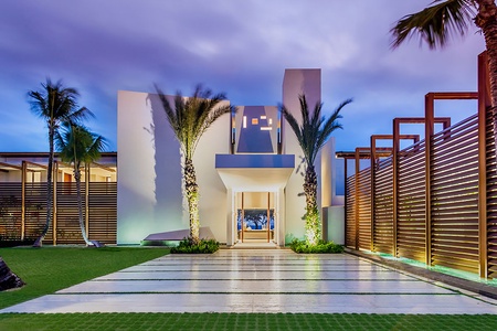 Modern entrance with sleek architectural design, inviting you into a luxurious experience.