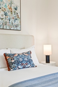 Thoughtful design and soft bedding make this space a tranquil place to rest and reset.