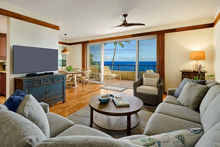 Unwind in the spacious living area with plush seating and panoramic ocean views.