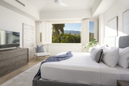 Wake up to mountain views framing your upper level bedroom, where white linens and natural light create your perfect morning sanctuary.