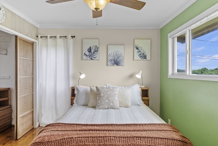 This inviting bedroom offers soft textures and soothing tones for a restful night's sleep.