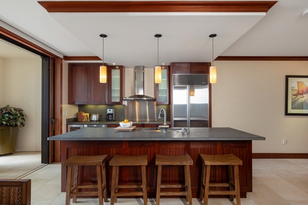 Expansive kitchen island with four barstools for casual bites.