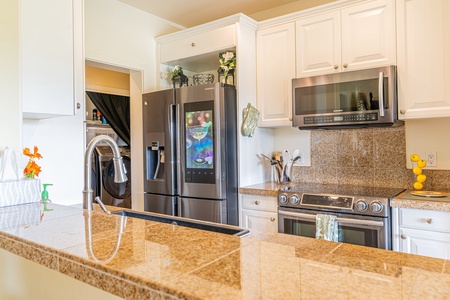 A gorgeous kitchen with stainless steel appliances.