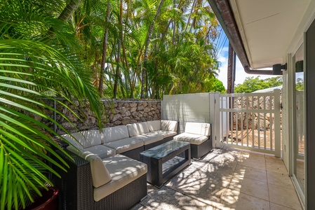 Private patio nook with sectional seating, ideal for quiet conversations.