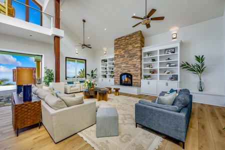 Spacious living area with a stone fireplace to gather with your loved ones.