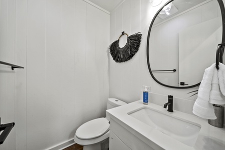 The bathroom featuring a sleek vanity and contemporary accents, ideal for freshening up between island outings.