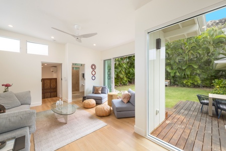 Experience the luxury of space in our light-filled open living area, anchored by cozy seating and mountain-view access.