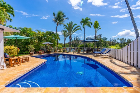 Enchanting evenings await by the shimmering pool under the twilight sky.