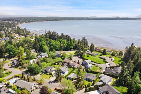 Captivating view of the lush greenery and serene beach in the neighborhood