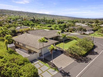 Bird’s-eye view of the home nestled in a tropical neighborhood.