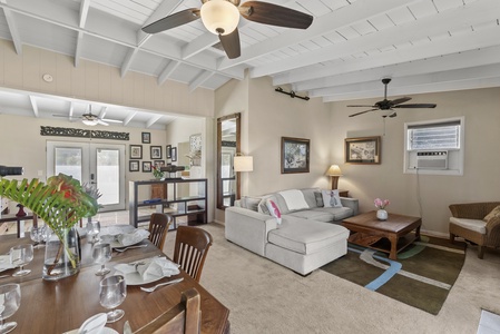 Open living and dining area with natural light and a coastal vibe.