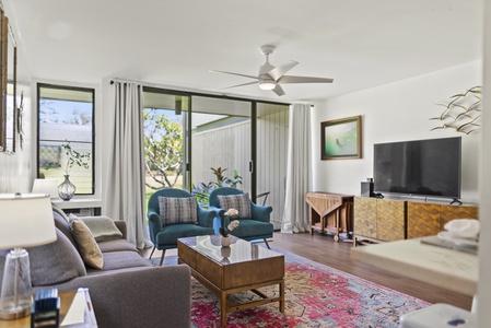 Thoughtfully decorated living room that looks out into the golf course.