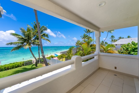 Soak in postcard-worthy views from this queen bedroom’s lanai—perfect for a morning coffee or evening wine.