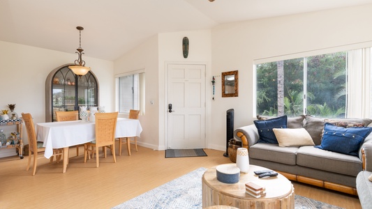 The bright kitchen features many amenities including a fridge, oven, extended counter-tops and high ceilings.