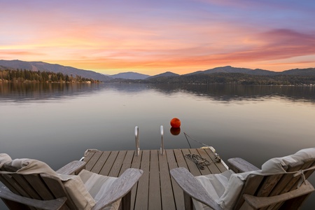 Sip wine at sunset as you gaze across tranquil waters—pure Pacific Northwest serenity from your private dock.