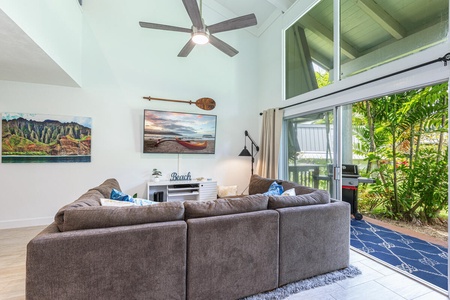 Breezy indoor-outdoor living with sliding doors that open to the tropical patio.