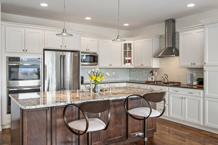 The kitchen bathed in warm lighting creates an inviting ambiance, inspiring culinary creativity