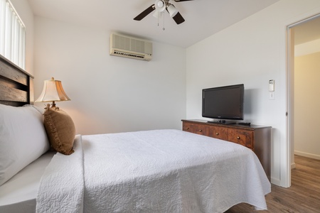 Unwind in your peaceful bedroom with crisp linens, gentle ceiling fan breeze, and your own TV for cozy nights in.