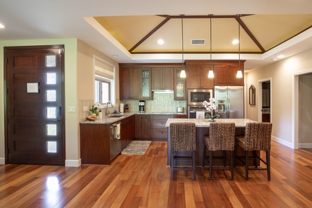 This gourmet kitchen combines beauty and function, with wood cabinetry and open sight lines for easy entertaining.