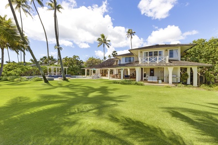 Expansive yard with tropical landscaping