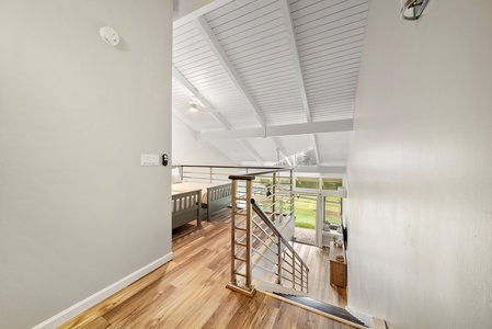 Custom staircase leading to the primary bedroom and twin loft.