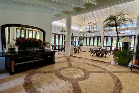 Elegant entryway with a decorative floor leading to the open-concept living space.