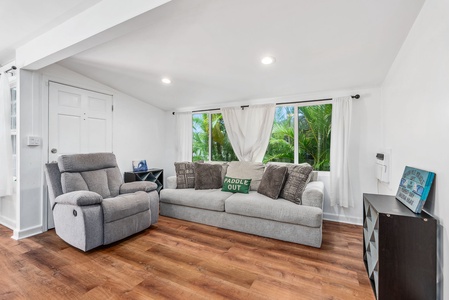 Bright and inviting living room with plush seating and a relaxed island vibe.