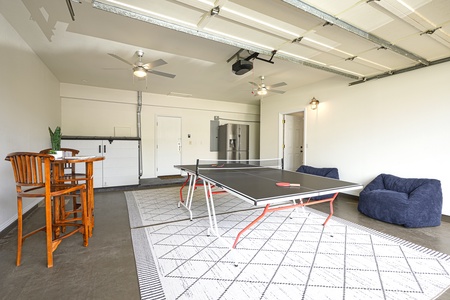 Challenge friends to ping pong in your private game room, complete with cozy seating and bar-height table for refreshments.