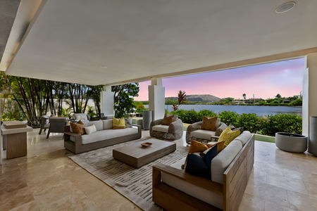 Whip up local favorites in the modern kitchen at Honolulu Lagoonfront Villa—complete with island seating and premium appliances.