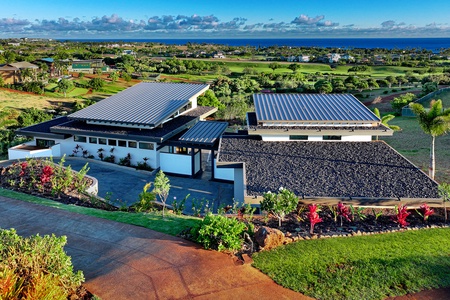 Take in the aerial views that overlook the exclusive Kukui'ula golf course, where lush greens meet azure skies.