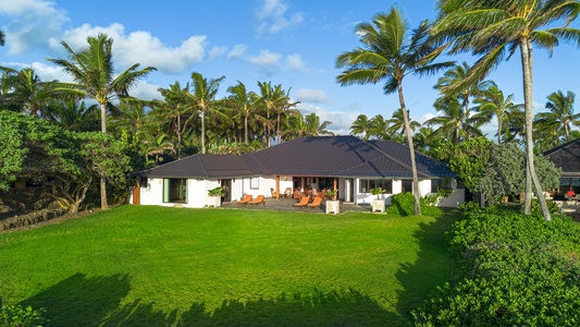 Expansive green lawn behind the estate offers open-air space and total seclusion.